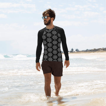 Model walking on the beach in the ocean, wearing the men's rash guard long sleeve swimming shirt.